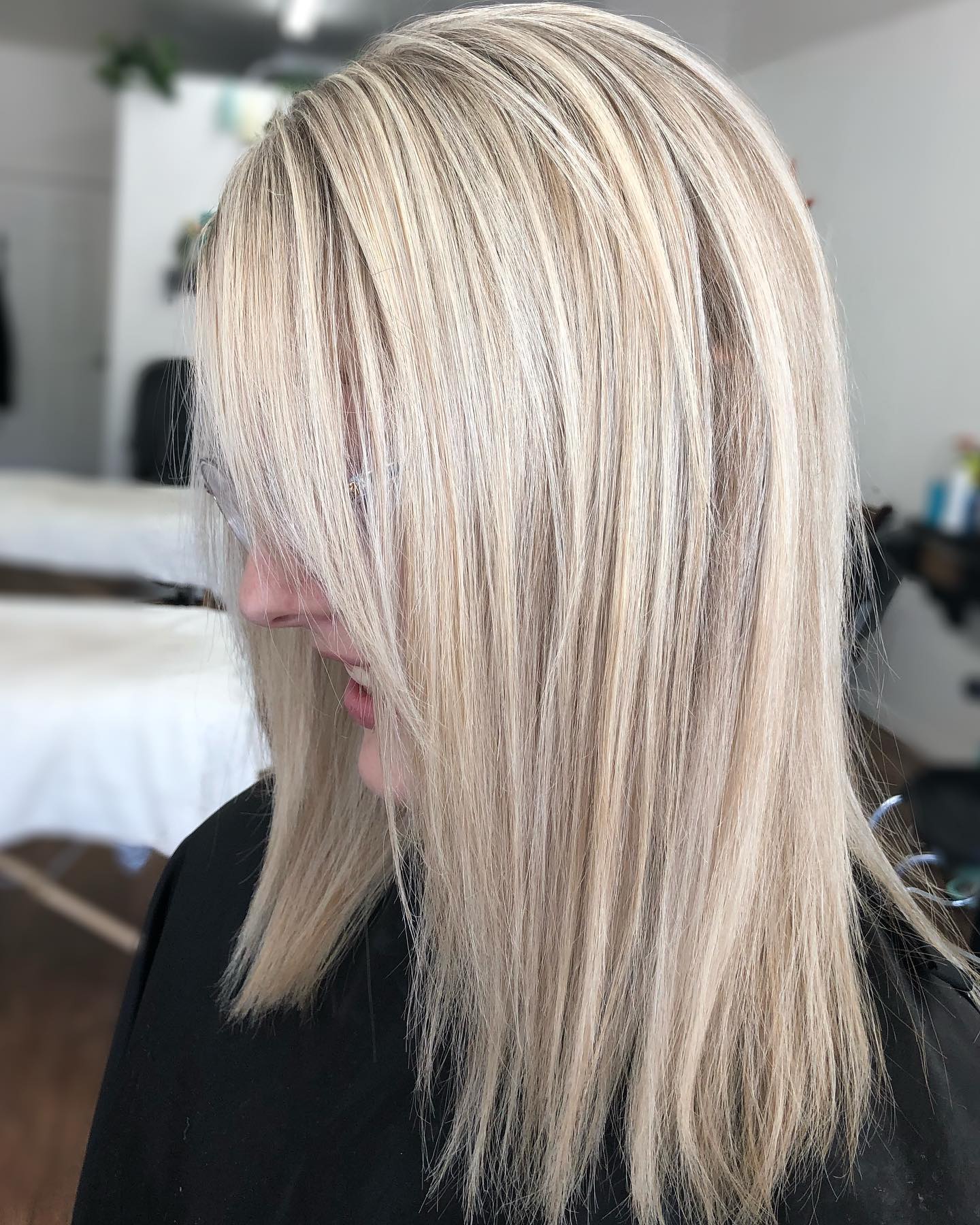 Soft blonde hair color styled at Hidden Beauty Salon